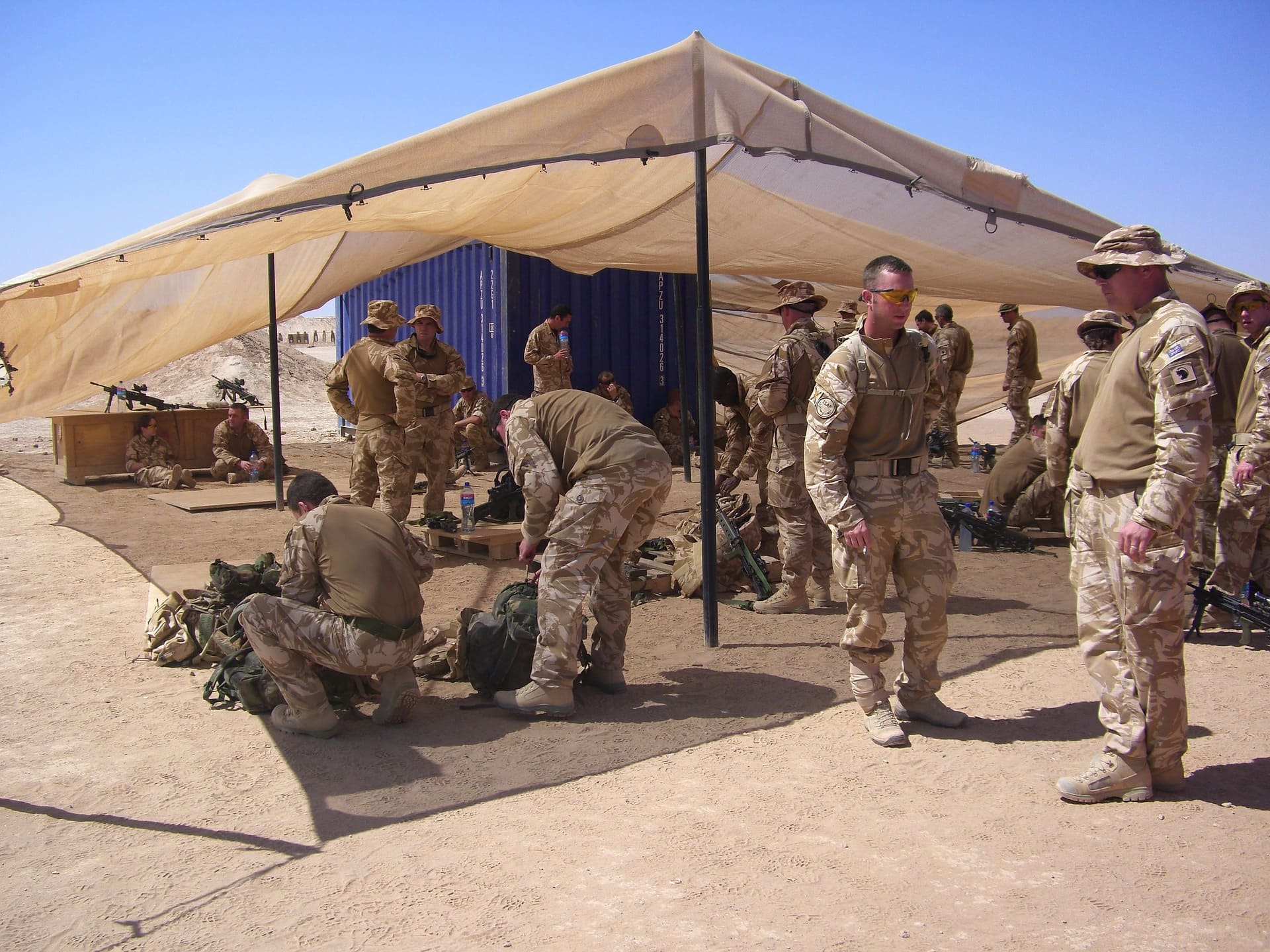 United States Soldiers Training in the Field with Augmented Reality Under a Tent